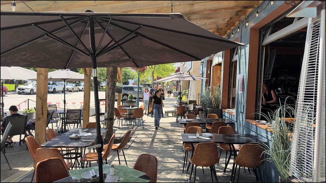 Artisan pizza and wine on the patio at Peachland’s best Italian restaurant