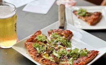 Artisan pizza and wine on the patio at Peachland’s best Italian restaurant